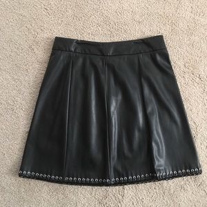 Woman’s Black Mini Skirt.  Looks like leather. 8